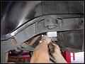 RE8003 Installing rear bump stop spacer.
