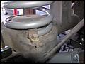 RE8003 Reinstall rear spring lower clamps.