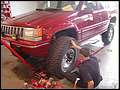 Bolting a mounted 35 inch BFG on 1994 Grand Cherokee ZJ.